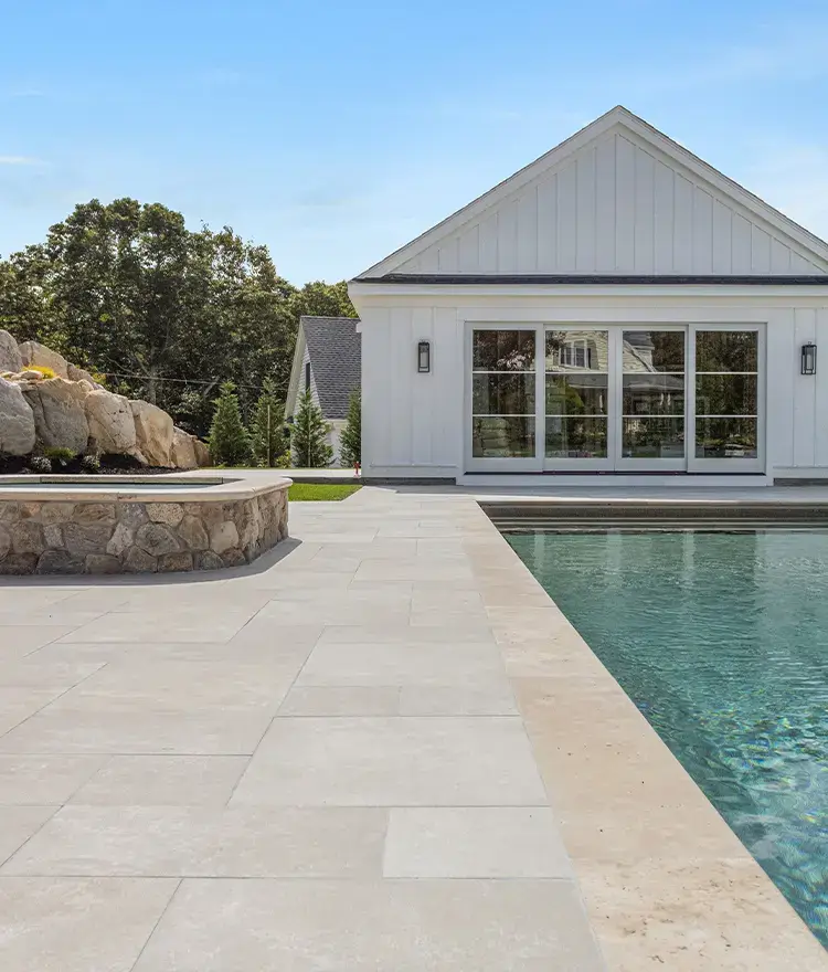 Everblue Sand pavers around a pool and pool house
