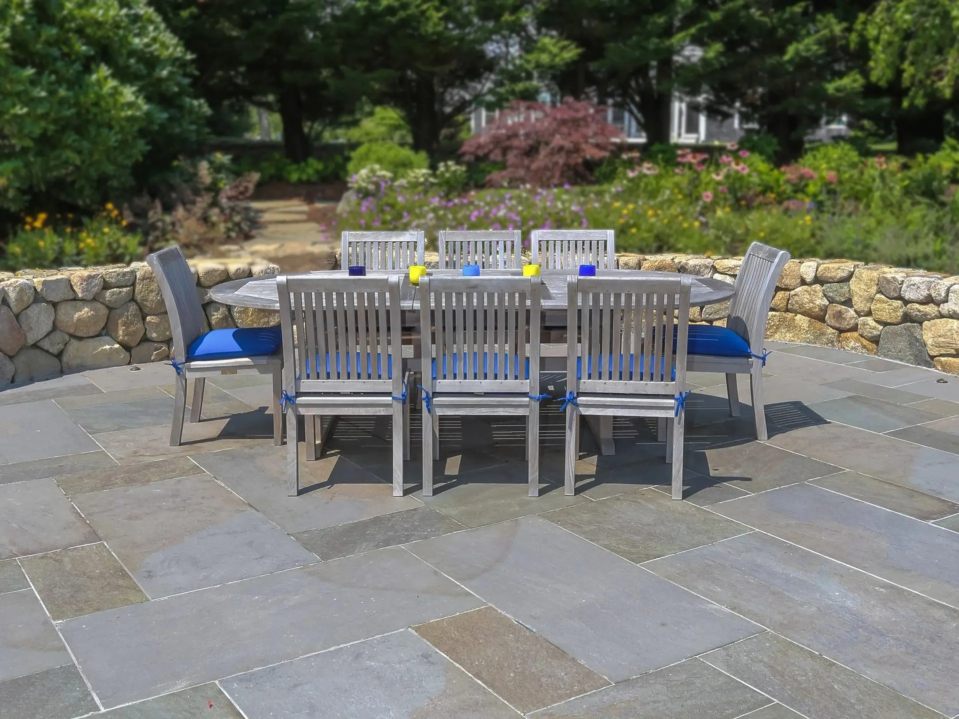 Natural Variegated Everblue patio with an outdoor dining set
