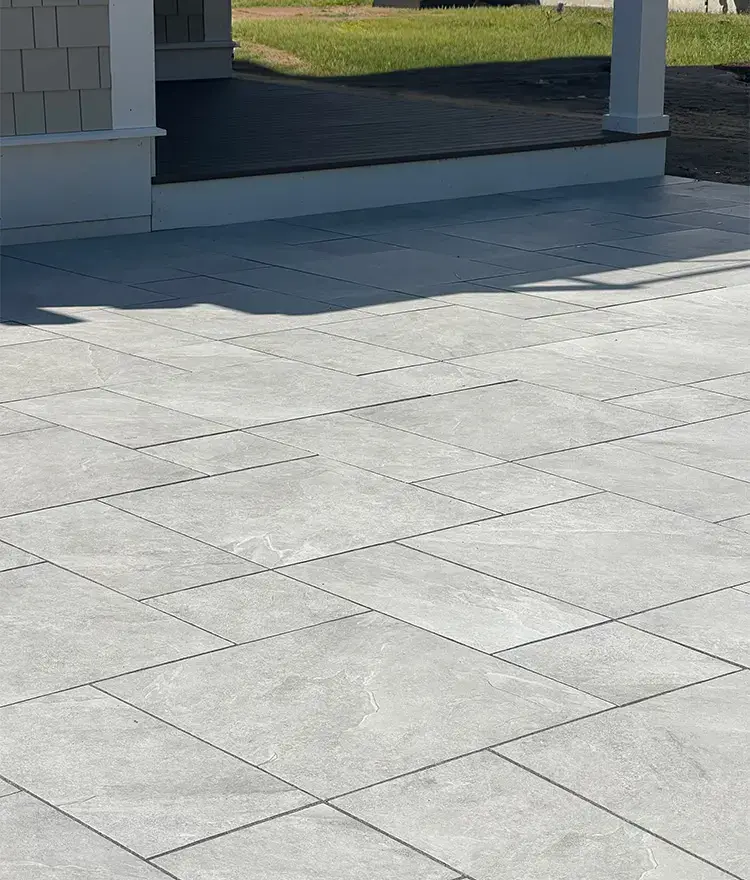 Light gray Everblue Smoke pavers laid in a large-format pattern, close up