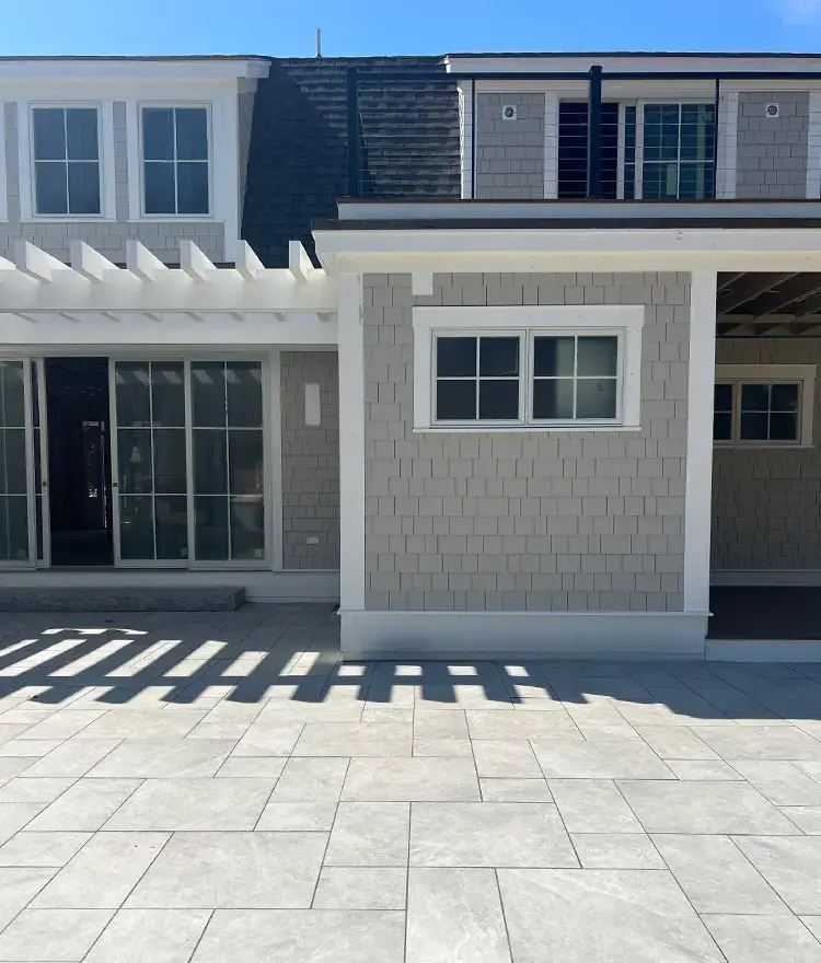 Everblue Smoke pavers on a shingle-style home’s terrace